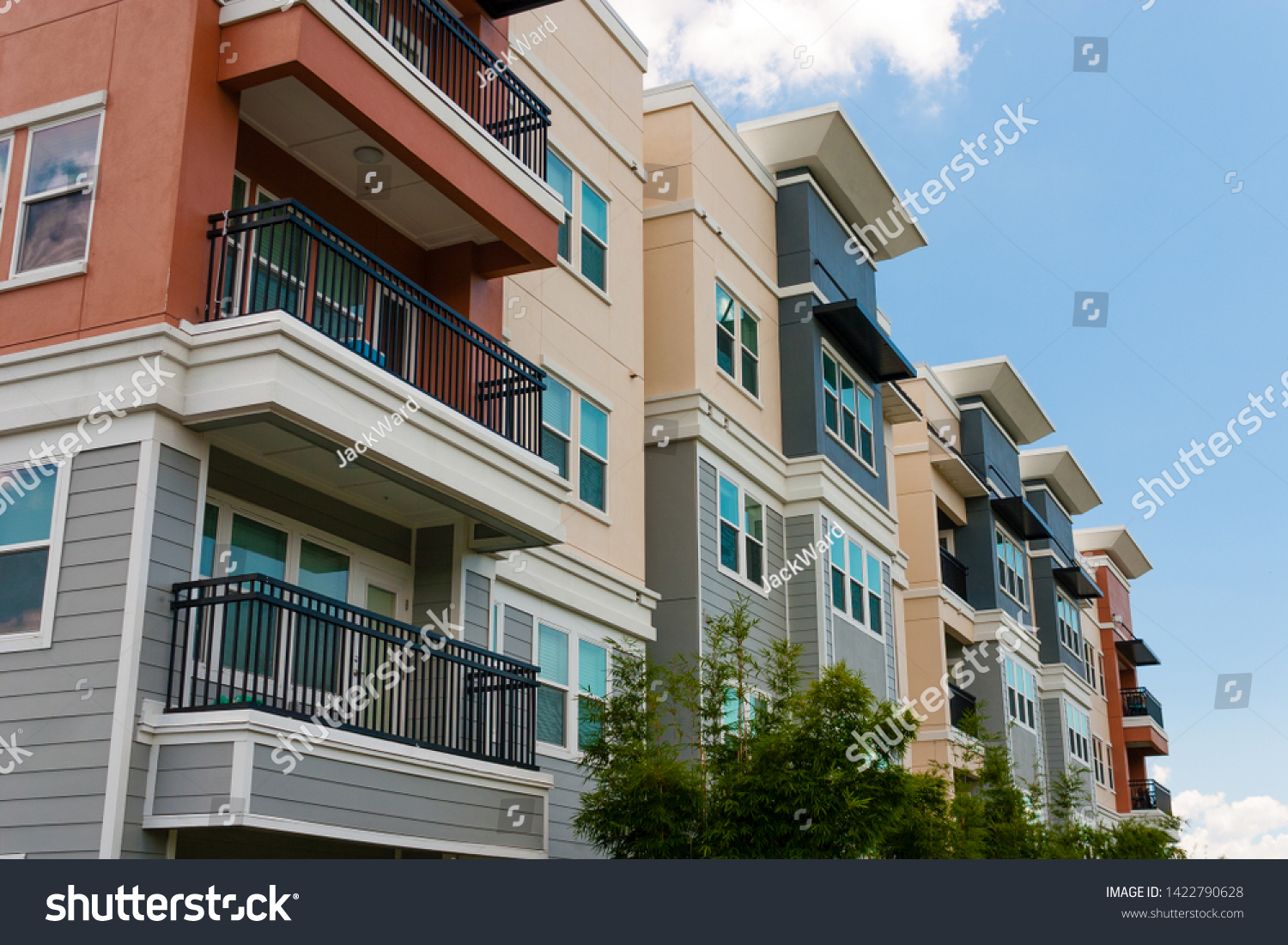 Modern luxury urban apartment building exterior with blue sky. #1422790628