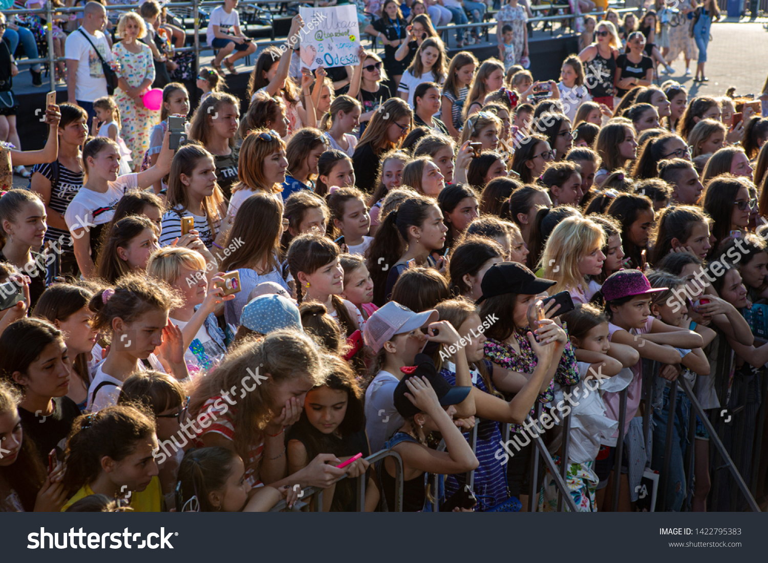 Odessa, Ukraine June 1, 2019: Many children at concert. crowd of children spectators at concert in honor of "International Children's Day". Crowd of joyful children at concert #1422795383