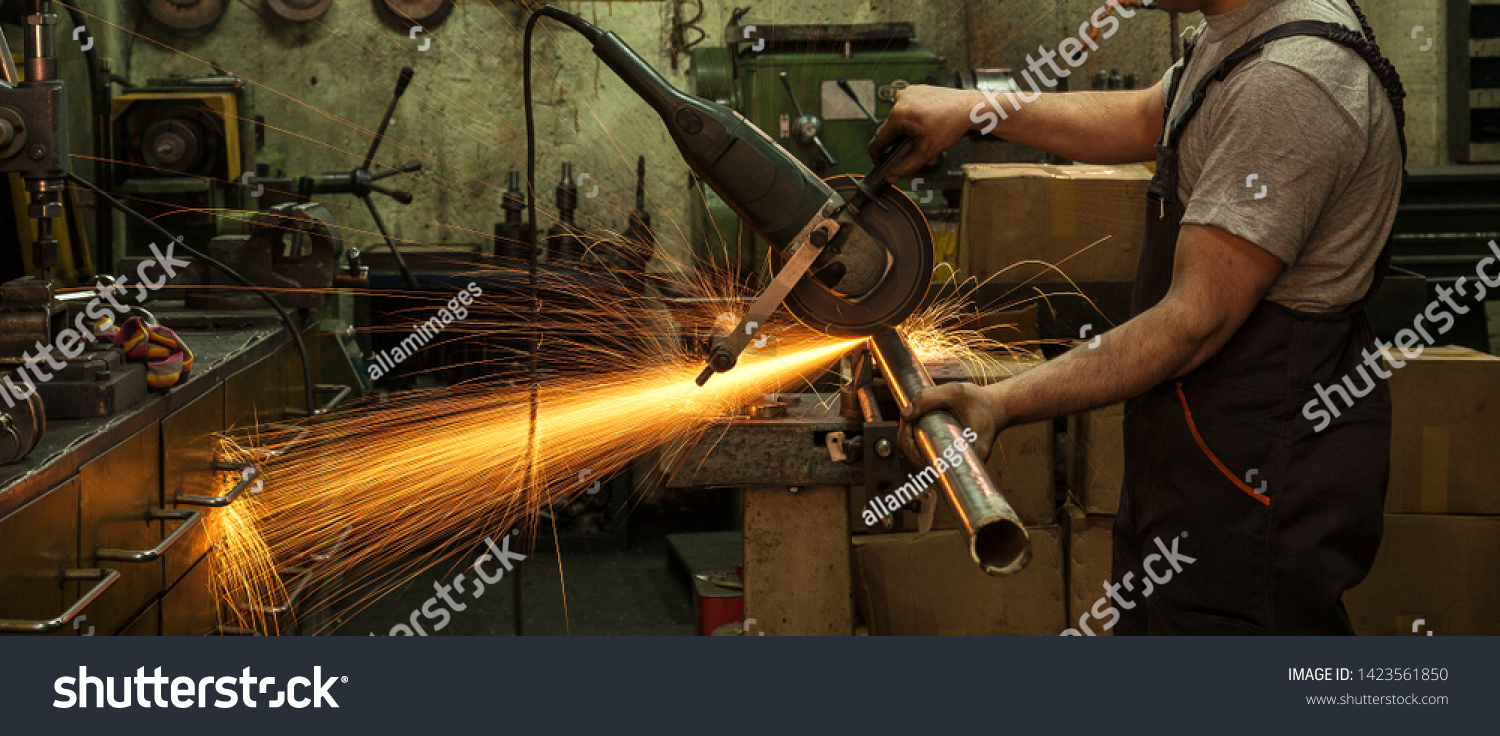 Industrial Industrial Industry Iron Production Workshop Working Factory Craftsman Hands Cutting Iron Bouncing Lights Yellow Workshop. #1423561850