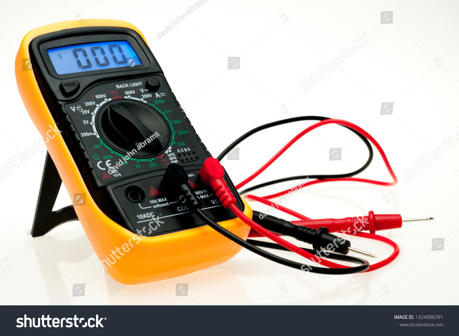 Digital multimeter with probes and blue backlit display on a white background #1424086391