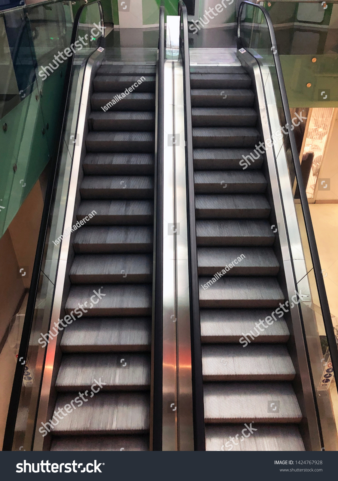 Escalators in a shopping mall. Moving stairways. #1424767928