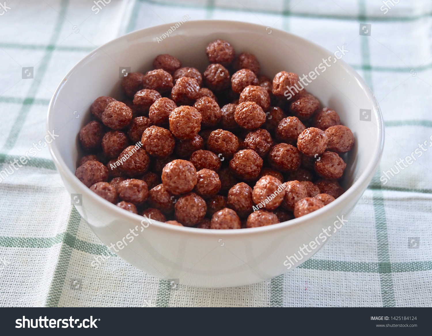 Chocolate Cornflakes in A Bowl, A Breakfast Cereal Made by Toasting Flakes of Corn or Maize. #1425184124