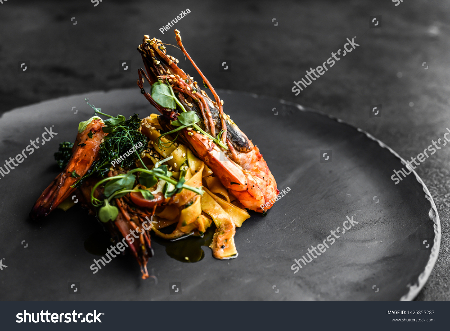 food fish elegant gourmet black plate top view lunch dinnerdish meal fine dining closeup green sea seafood shrimp beautiful modern #1425855287