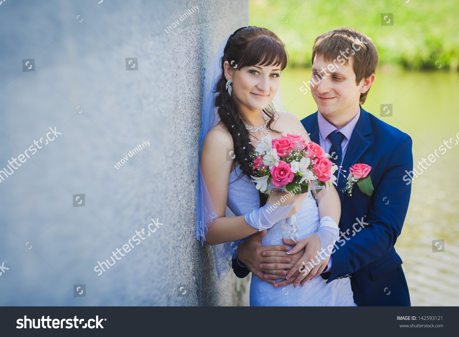 happy bride and groom are hugging on stairs #142593121