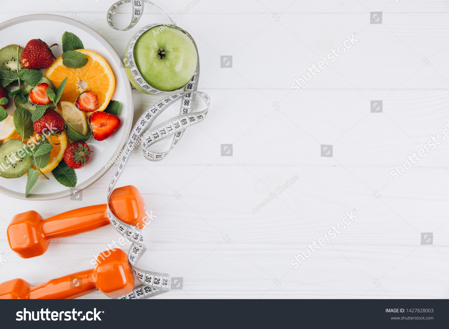Diet plan, menu or program, tape measure, water, dumbbells and diet food of fresh fruits on white background, weight loss and detox concept, top view #1427828003