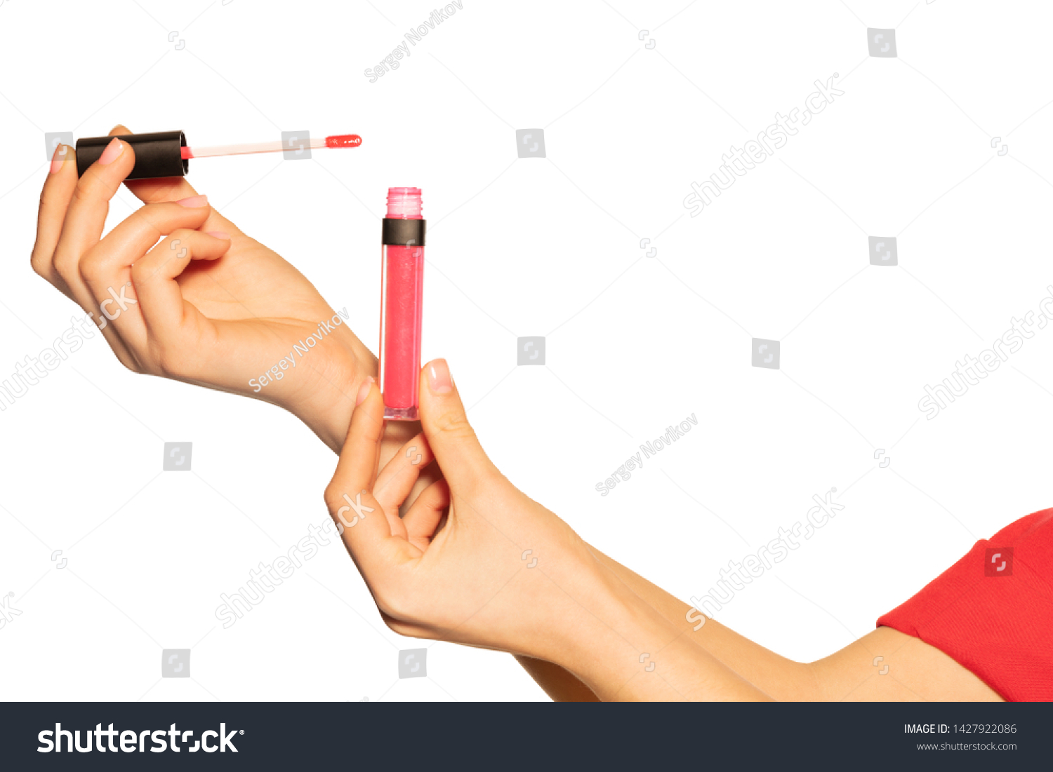 Woman's hands with liquid lipstick and applicator #1427922086