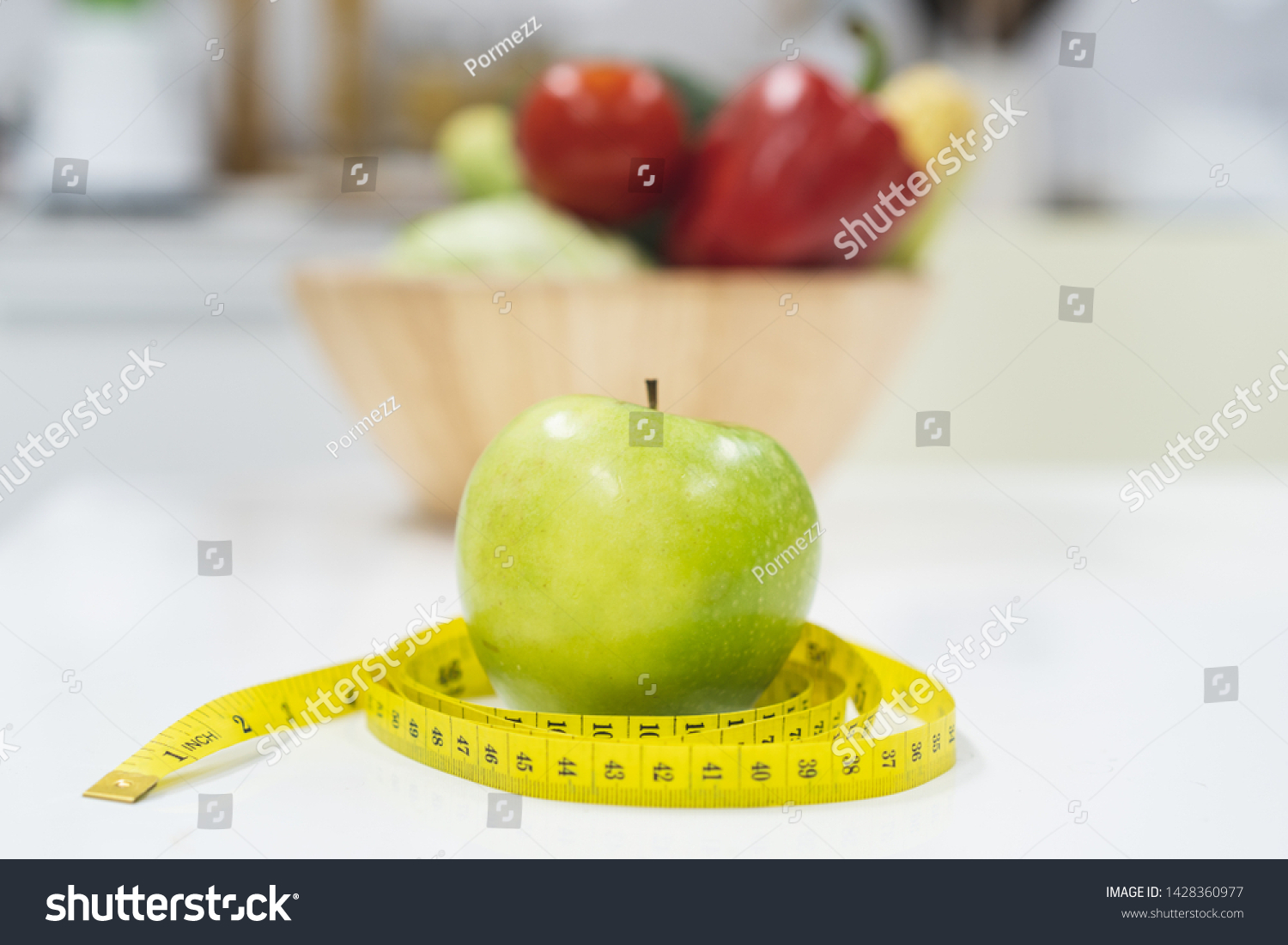 Diet breakfast concept. green apple and measure tape. #1428360977