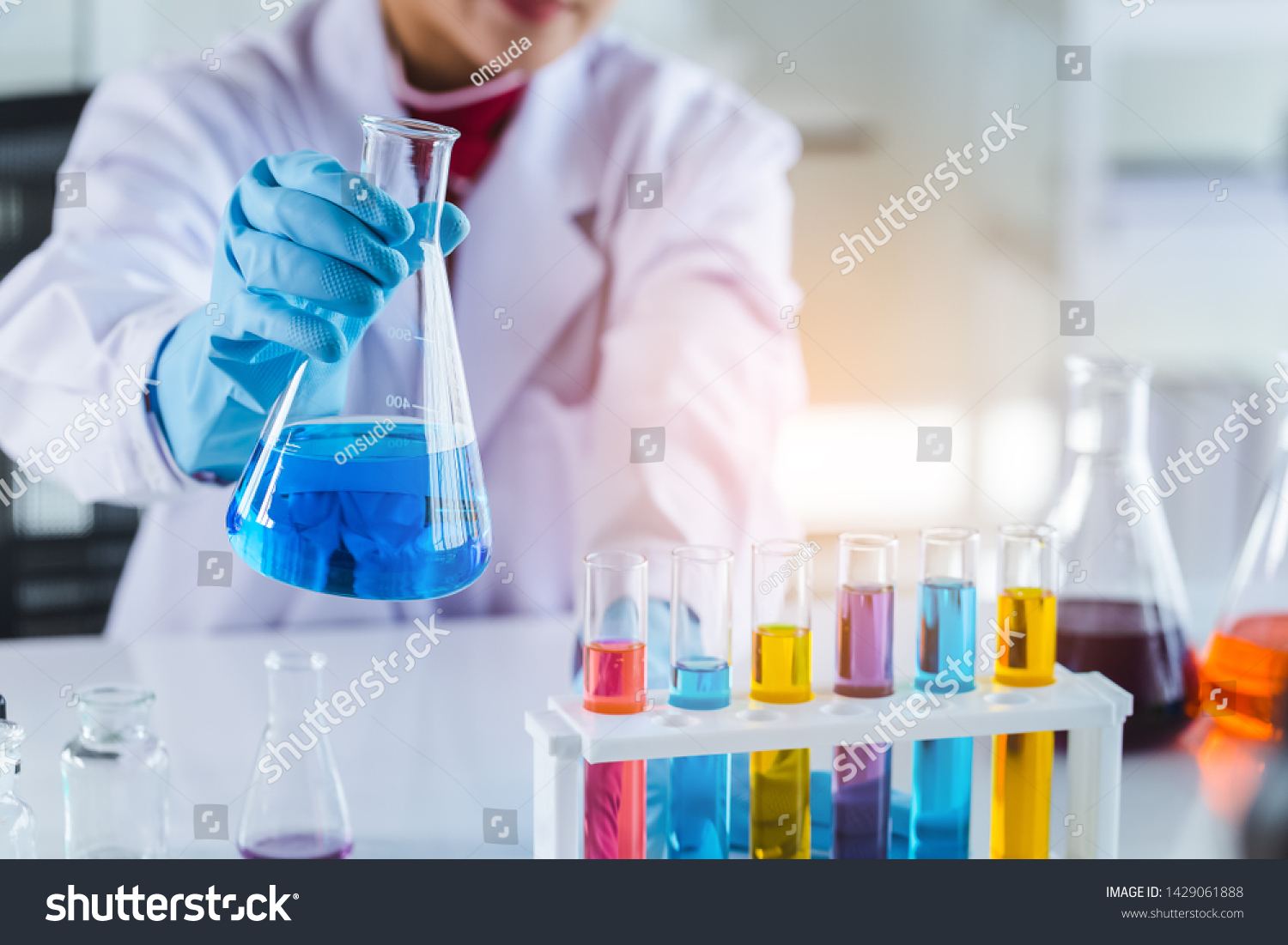 laboratory research and development concept with scientist and lab glassware #1429061888