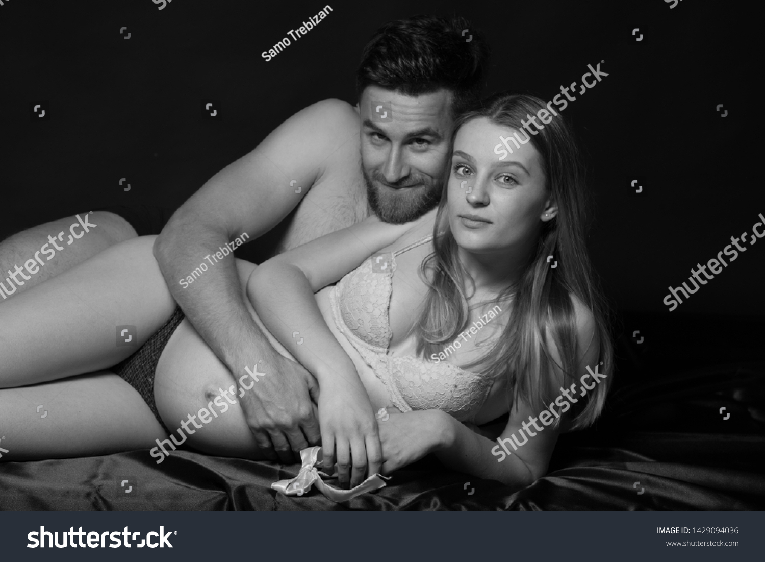Pregnant woman and her man  studio black and white photography #1429094036