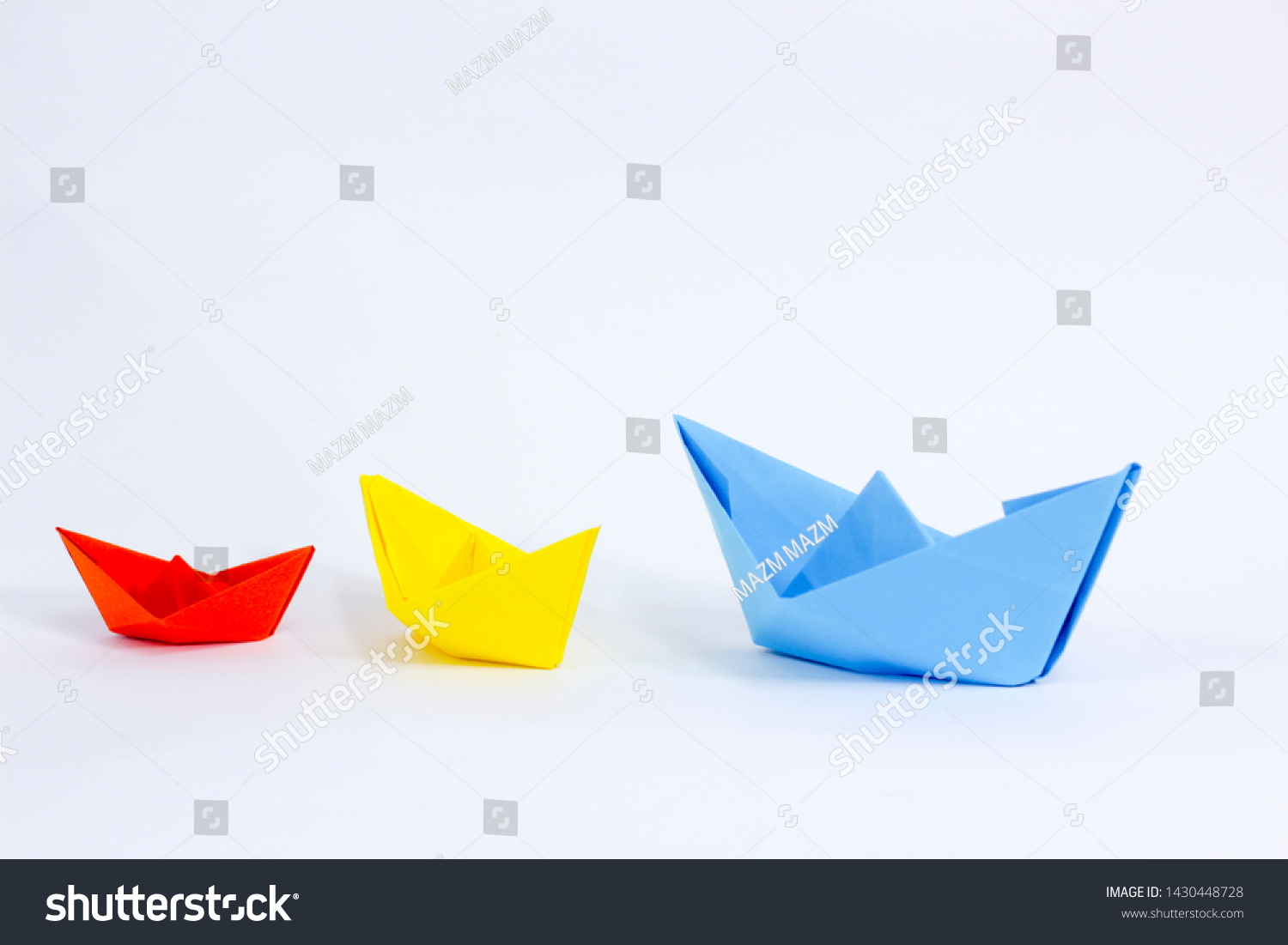Colorful paper color. Ship shape of origami.  Easy origami shape to build. Origami with white background. Different size of ship shape. #1430448728