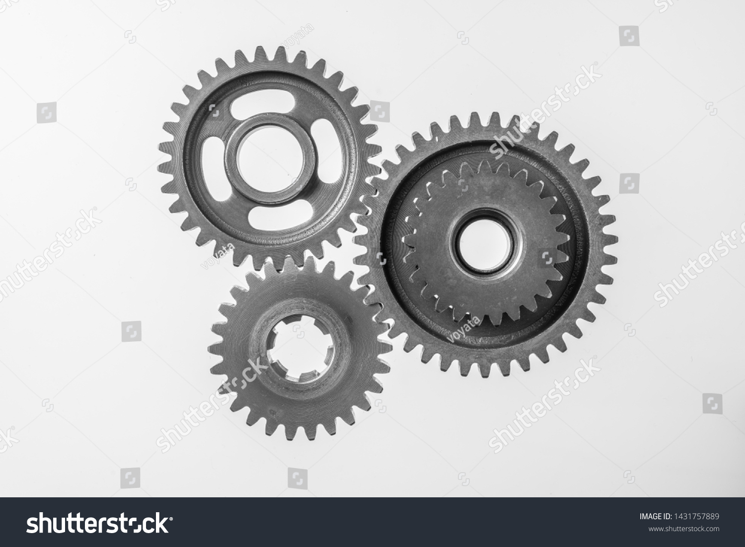 Teamwork business concept - top view of 3 metal gear isolated on white background for mockup. real photo, not 3D render #1431757889