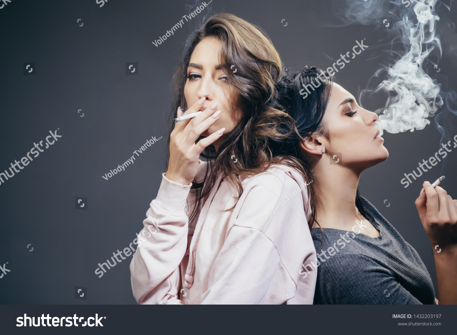Addiction is a disease. Pretty women with smoking addiction. Sensual girls with nicitine addiction smoking cigarettes. Addiction and dependence, copy space. #1432203197
