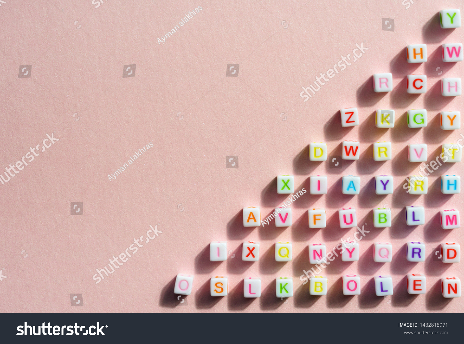 Colorful alphabetical cubes on pink bright background  #1432818971