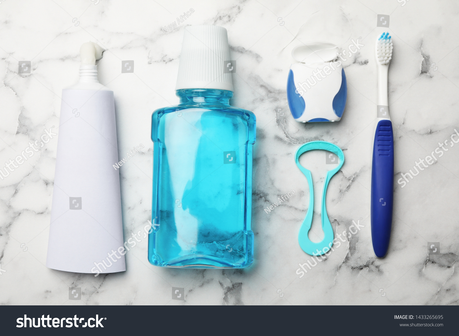 Flat lay composition with tongue cleaner and teeth care products on marble background #1433265695