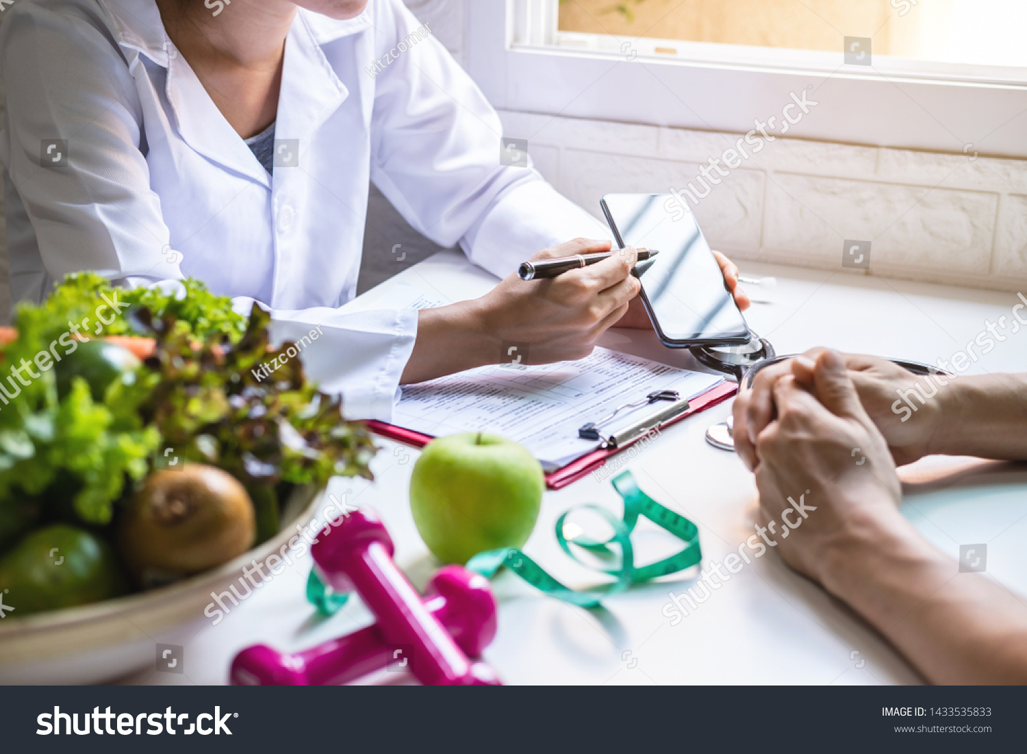 Nutritionist giving consultation to patient with healthy fruit and vegetable, Right nutrition and diet concept #1433535833