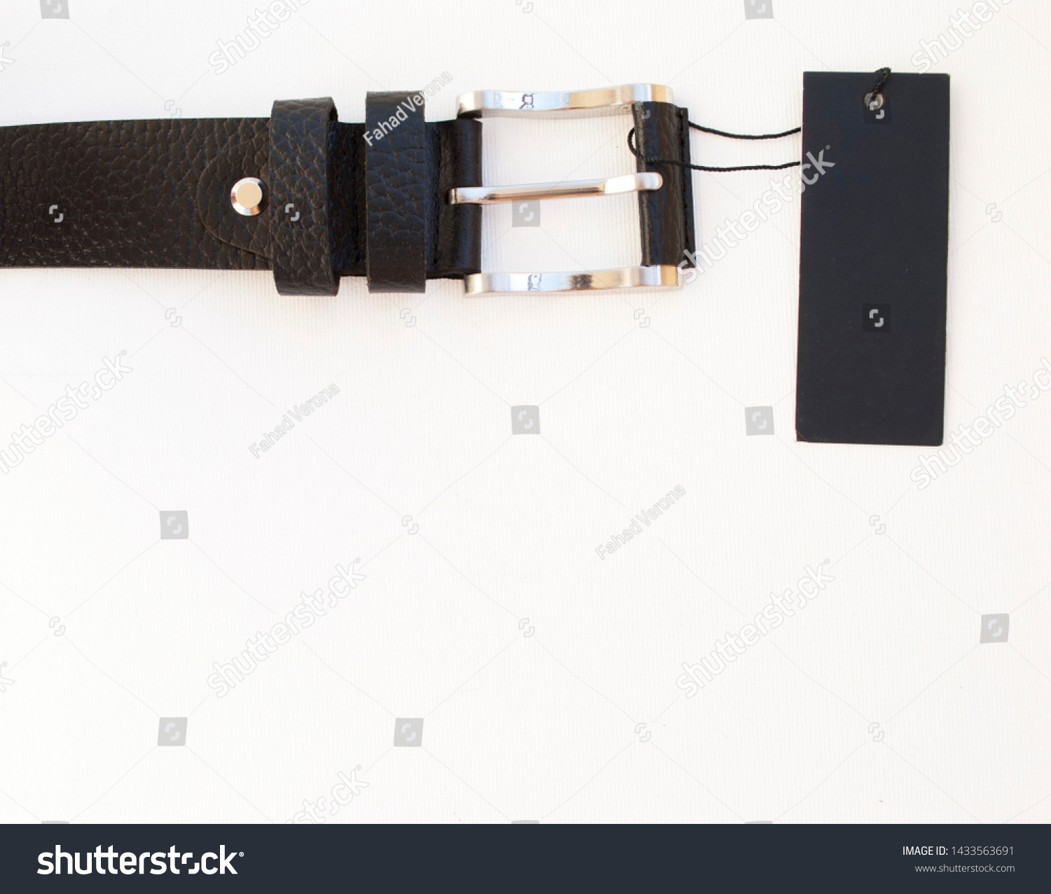new black leather men's belt on a white background with a black label #1433563691