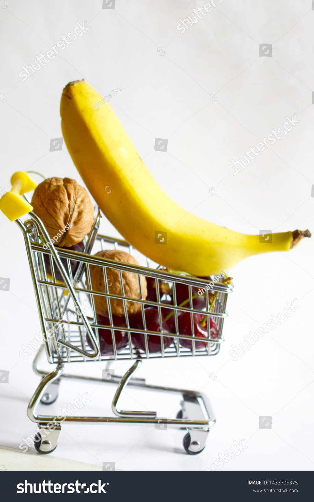  shopping cart with nuts and banana #1433705375