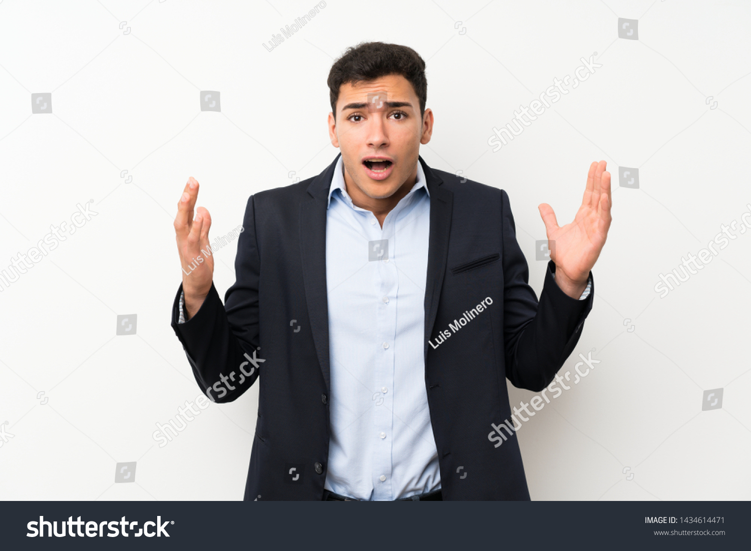 Handsome man over isolated white wall with surprise facial expression #1434614471