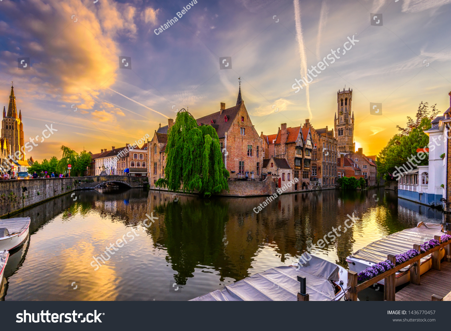 Classic view of the historic city center of Bruges (Brugge), West Flanders province, Belgium. Sunset cityscape of Bruges. Canals of Brugge #1436770457