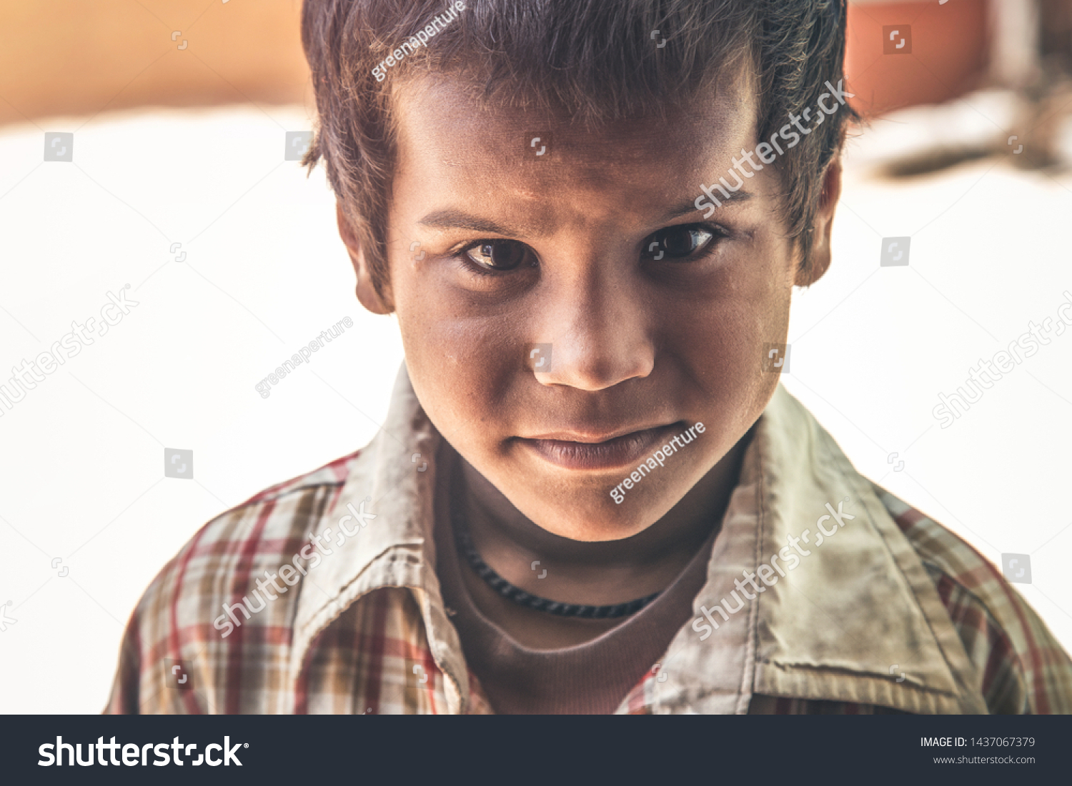 A portrait of a poor innocent Indian boy from a village #1437067379