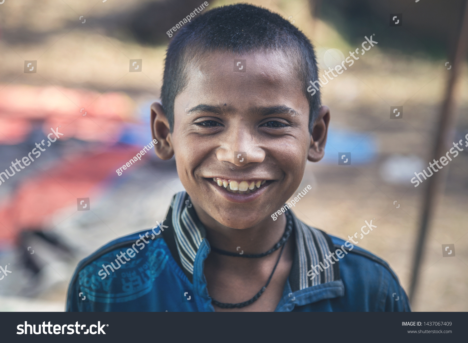 A portrait of a poor innocent Indian boy from a village #1437067409