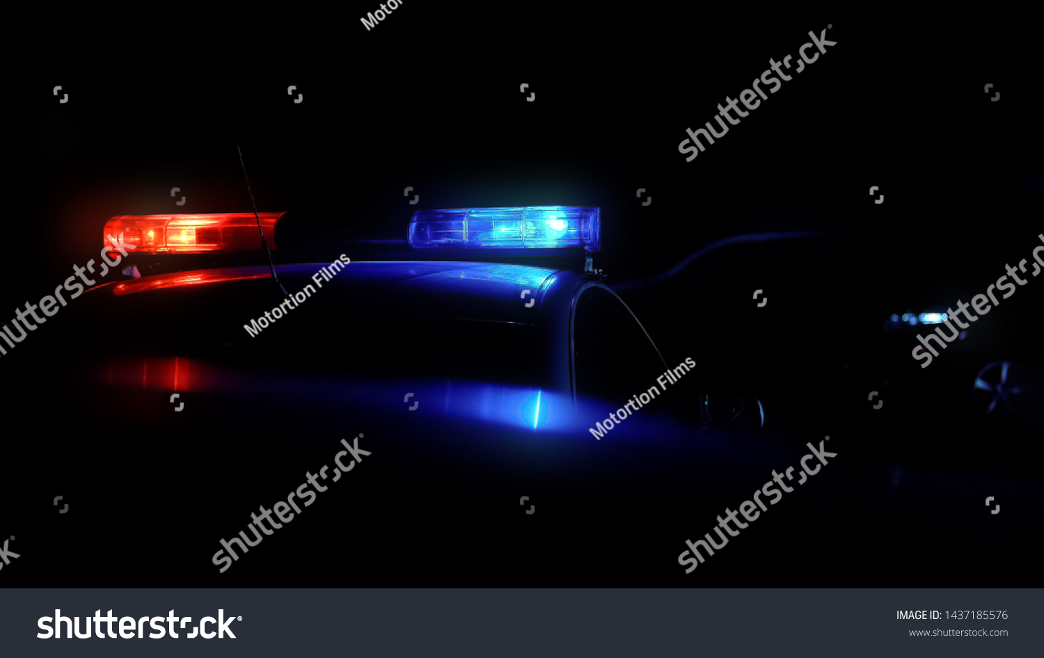 Patrol car driving along night city with flashing lights #1437185576