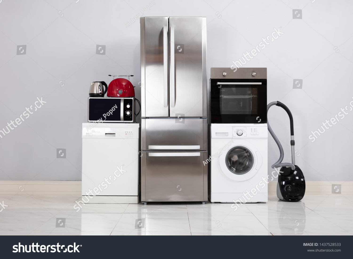 Close-up Of Home Electronic Appliances On Floor Against Grey Wall In New House #1437528533