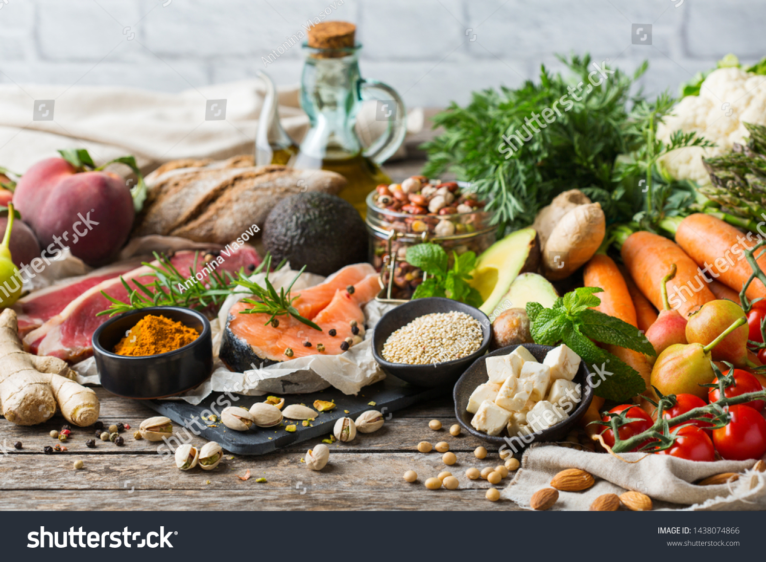 Balanced nutrition concept for clean eating flexitarian mediterranean diet. Assortment of healthy food ingredients for cooking on a wooden kitchen table. #1438074866