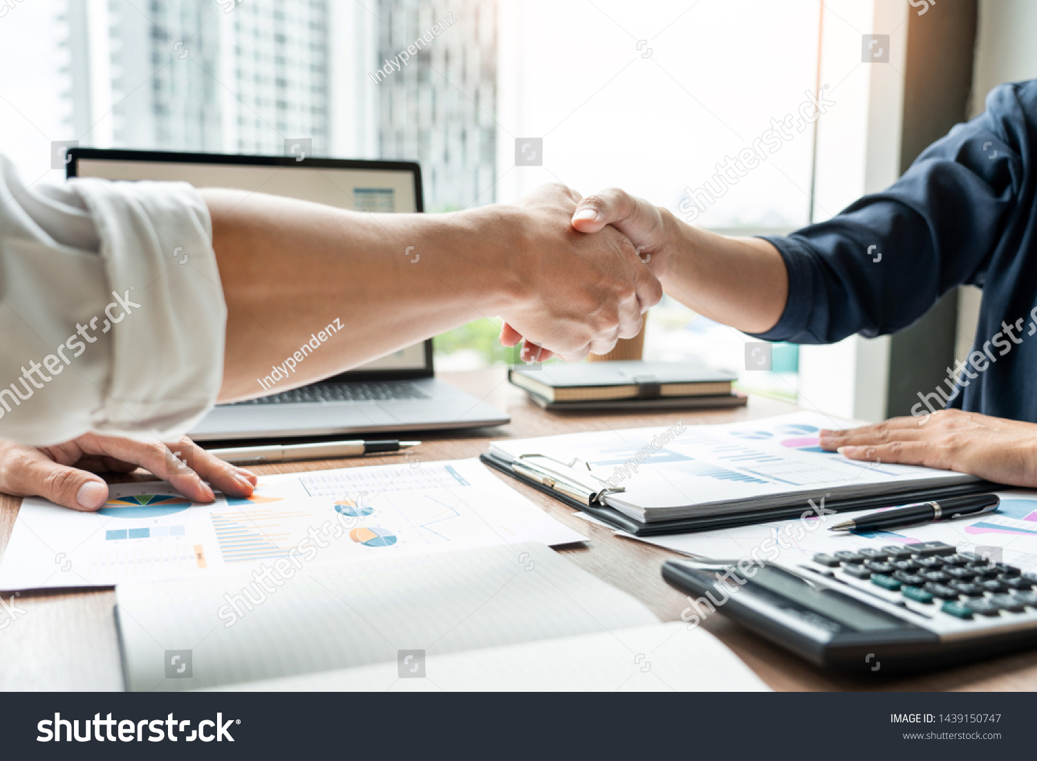 Business handshake after agreement meeting or negotiation finishing up dealing project, partnership approval and deal concept

 #1439150747