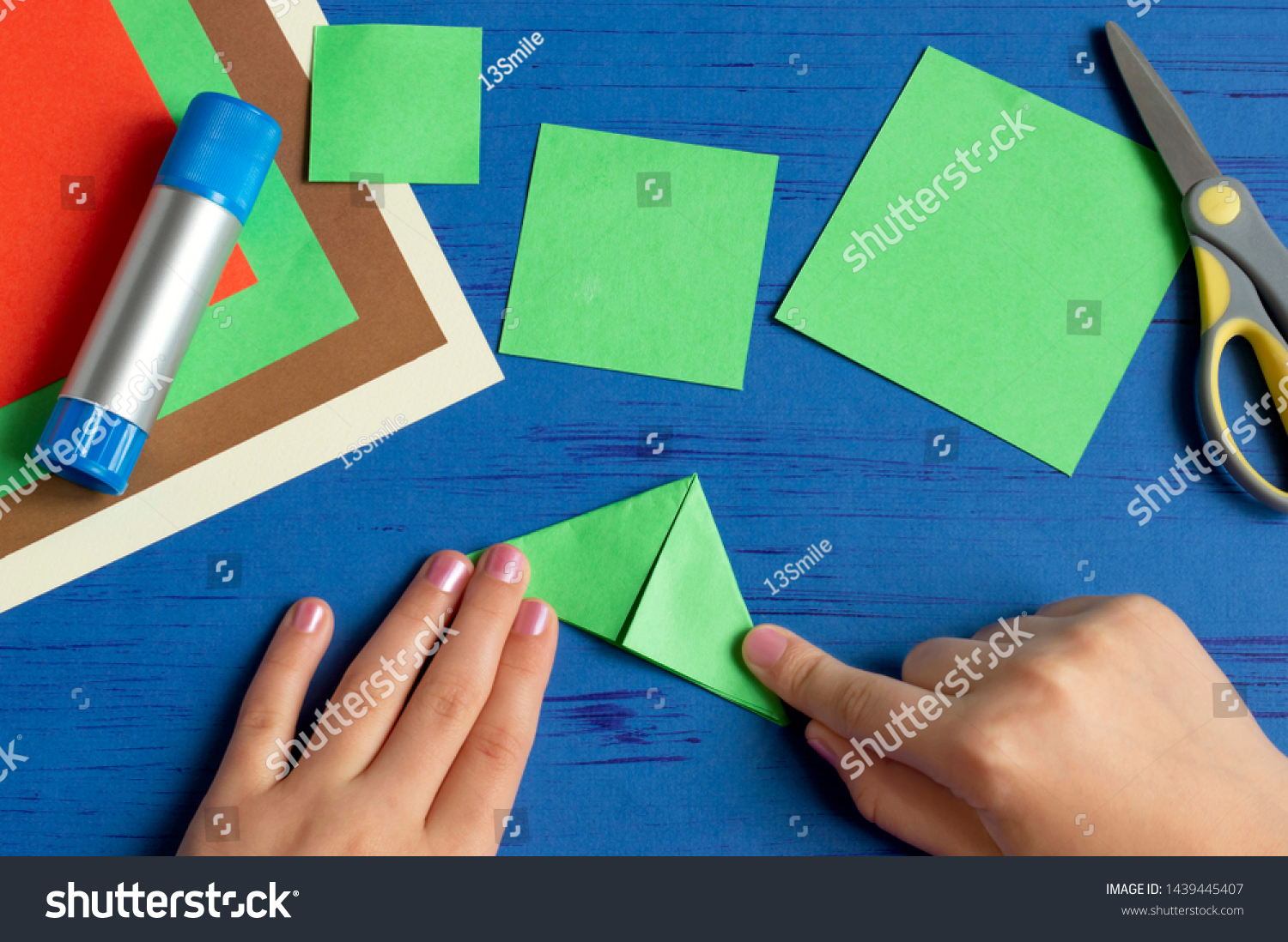 How to make Christmas card with Christmas tree. Original children's art project. DIY concept. Step-by-step photo instructions. Step 4. Fold corners towards each other  #1439445407