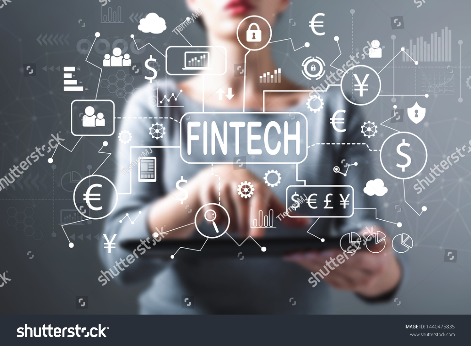 Fintech theme with business woman using a tablet computer #1440475835