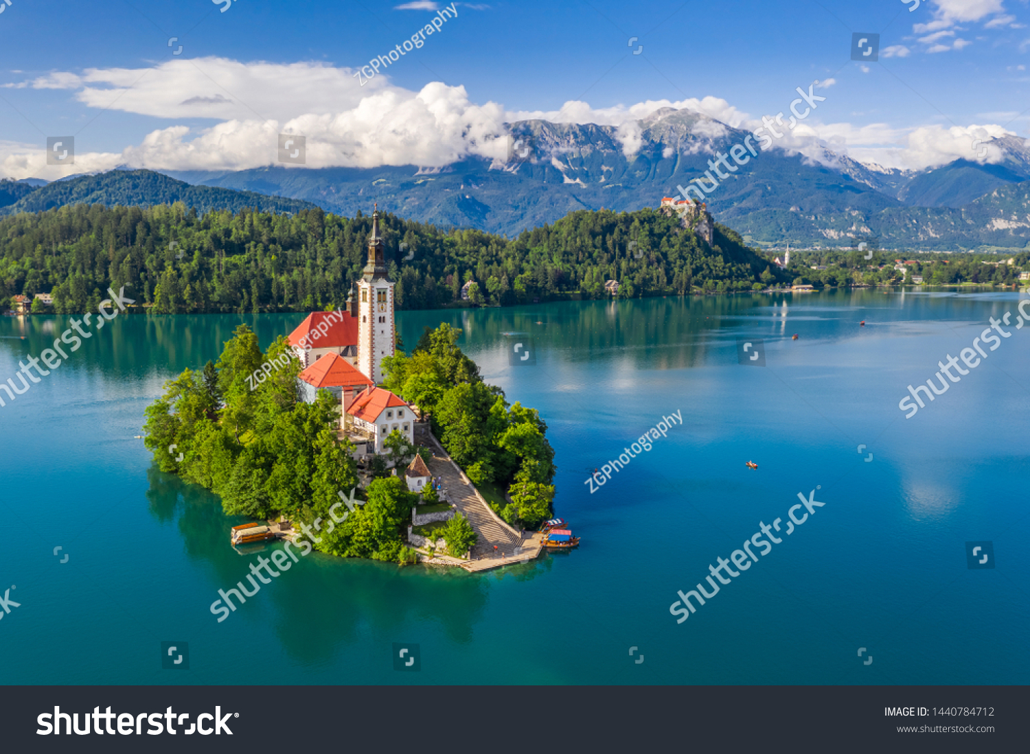 Lake Bled, Slovenia - Beautiful aerial view of Lake Bled (Blejsko Jezero) with the Pilgrimage Church of the Assumption of Maria on a small island and Bled Castle and Julian Alps at backgroud at summer #1440784712
