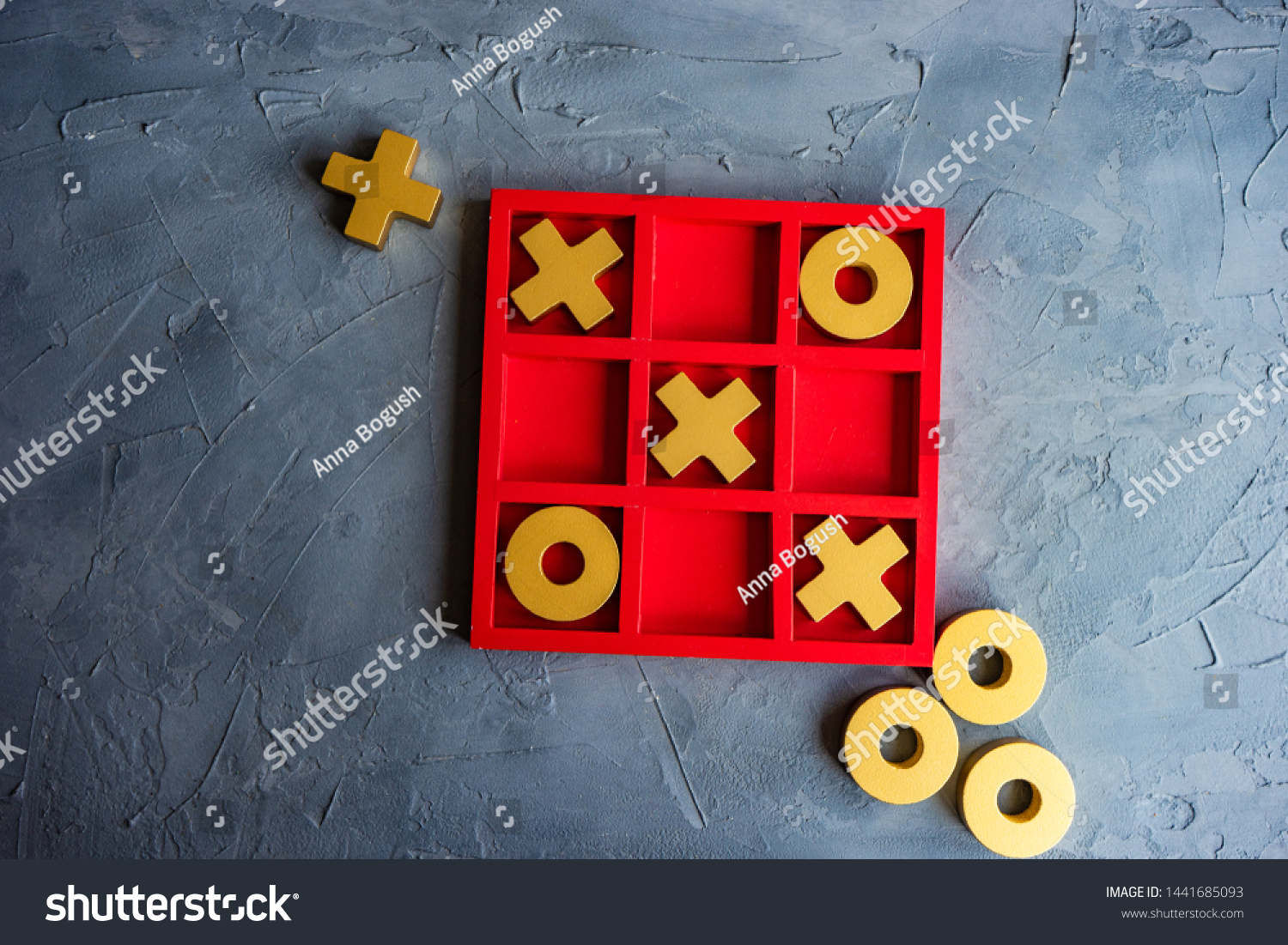 Kid tic-tac-toe board game concept on concrete background with copy space #1441685093