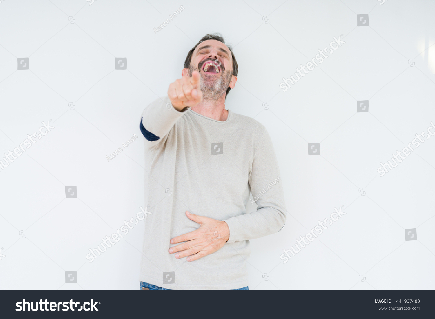 Elegant senior man over isolated background Laughing of you, pointing to the camera with finger hand over chest, shame expression #1441907483