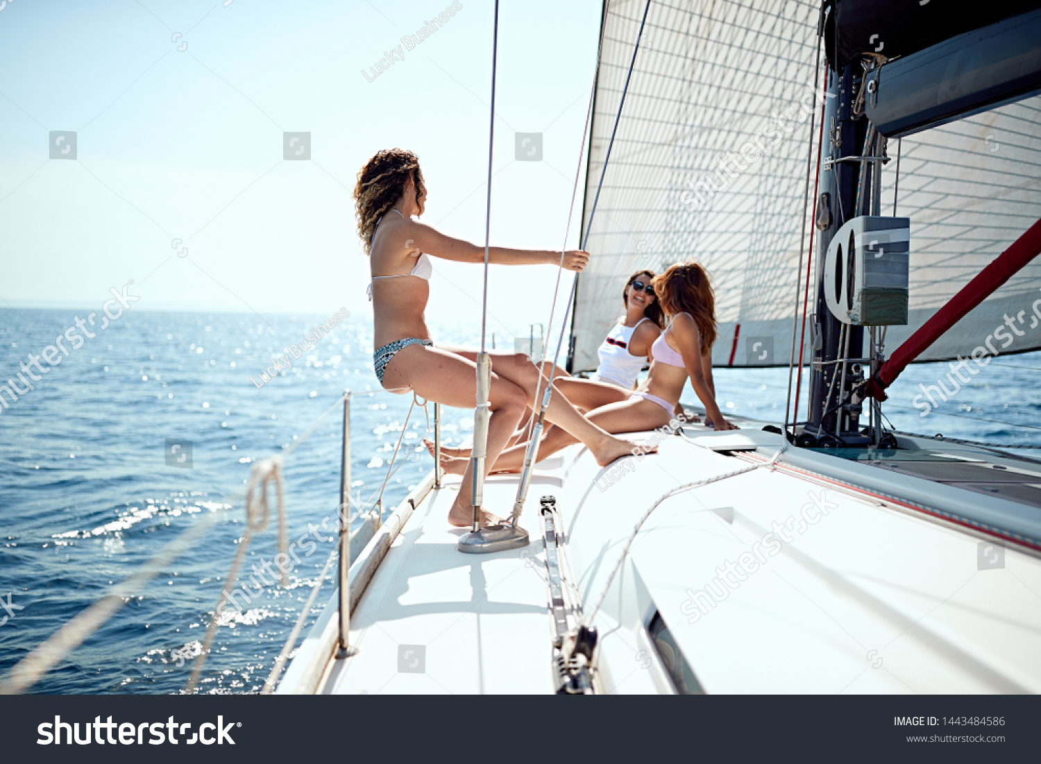 Young cheerful people having fun in boat at summer day
 #1443484586
