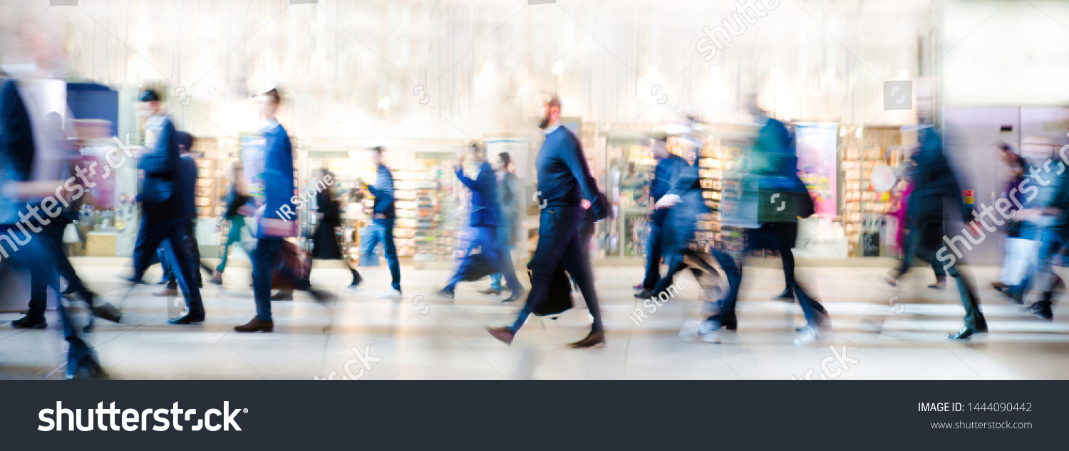 Beautiful motion blur of walking people. Early morning rush hours, busy modern life concept. Ideal for websites and magazines layouts #1444090442