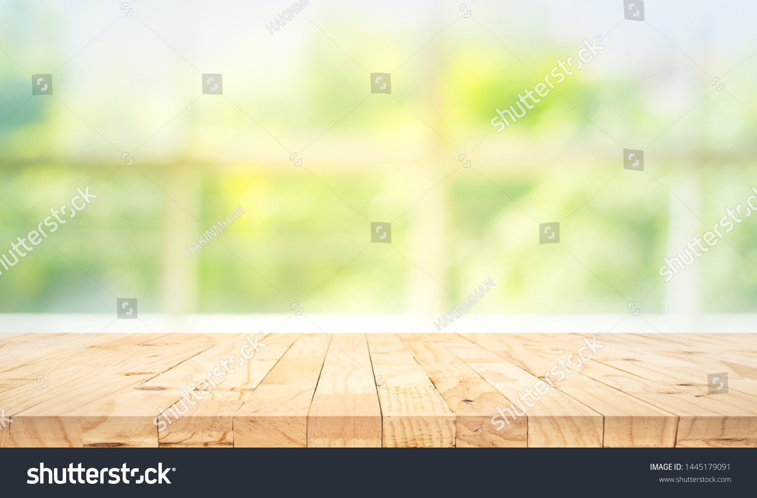 Empty wood table top on blur abstract green garden from window view in the morning. For montage product display or design key visual layout #1445179091