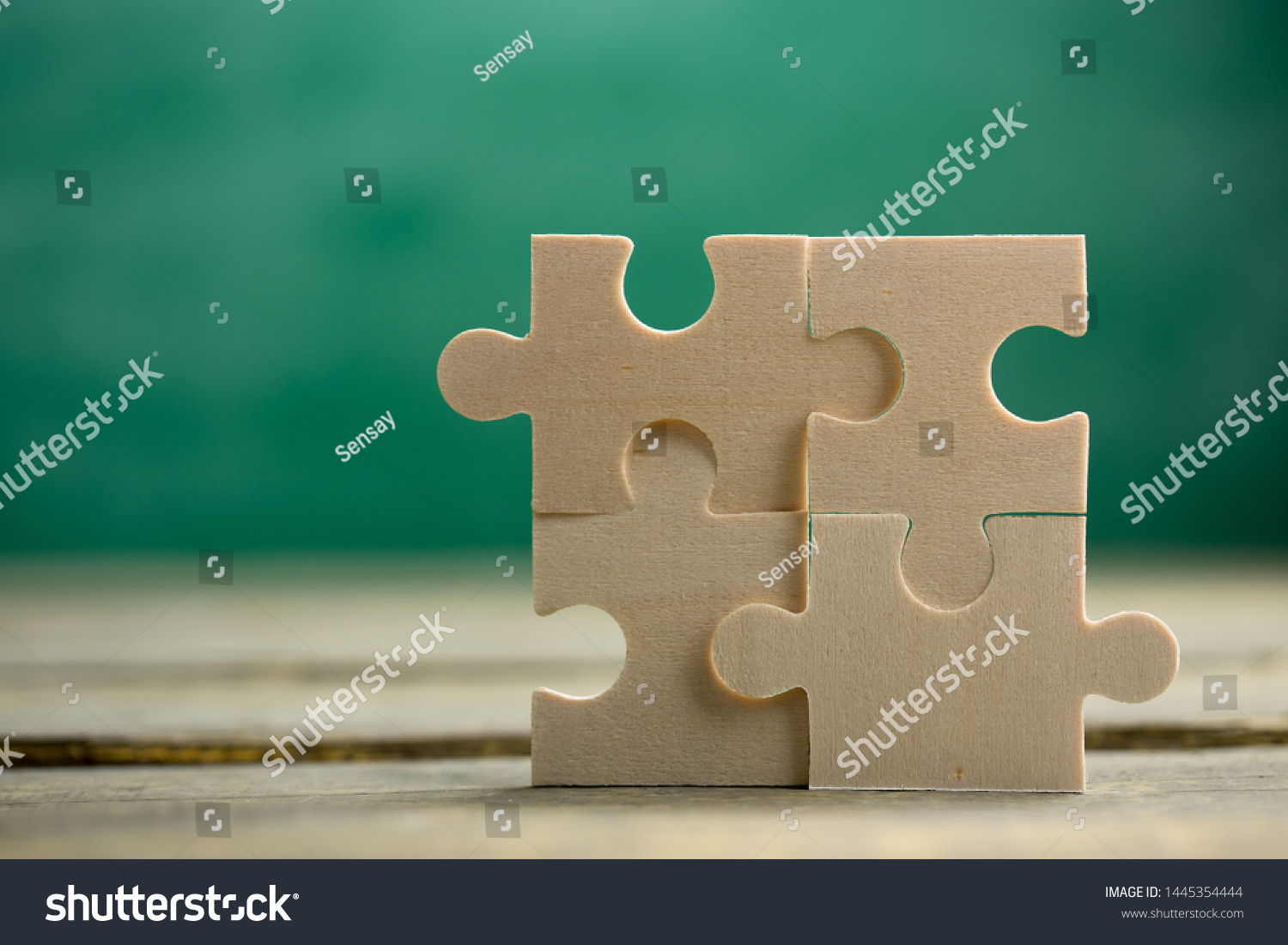 Creative solution for idea - business concept, jigsaw puzzle on the green blackboard background #1445354444