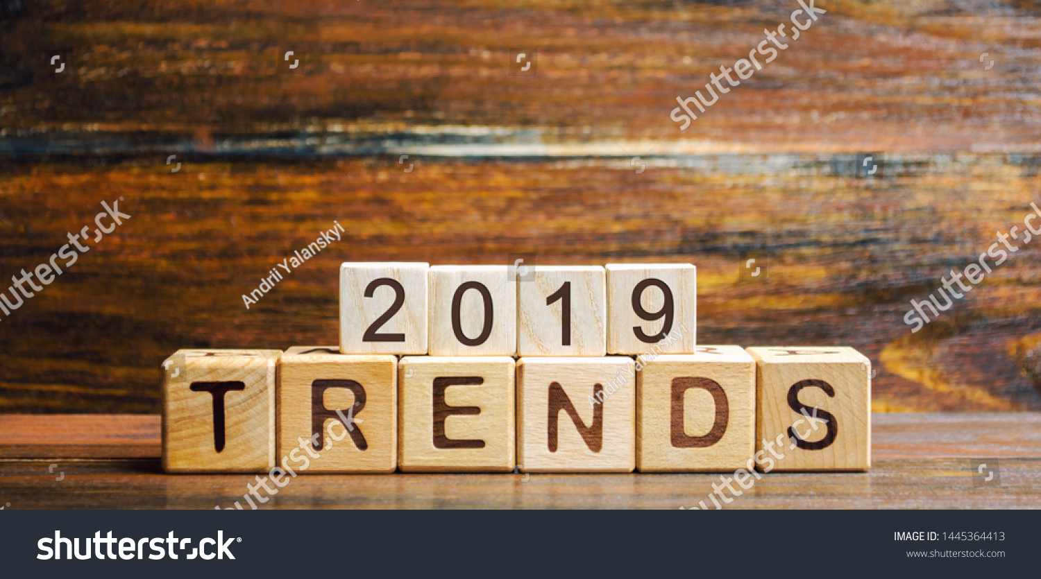 Wooden blocks with the word Trends 2019. Main trend of changing something. Popular and relevant topics. New ideological trends of fashion. Recent and latest trend. Evaluation methods. Fashionable #1445364413