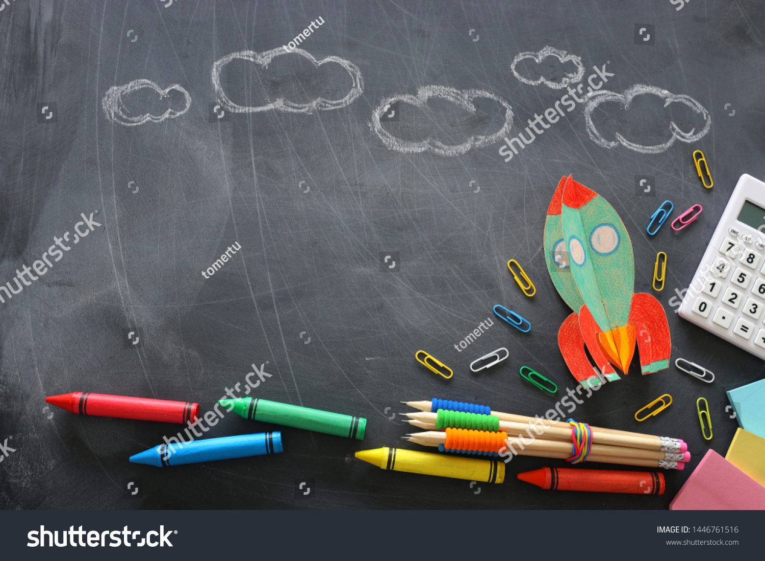 education. Back to school concept. rocket cut from paper and painted over blackboard background. top view, flat lay #1446761516