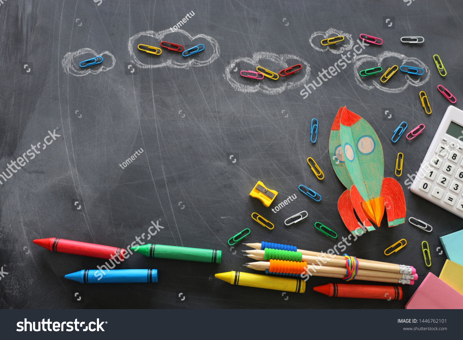 education. Back to school concept. rocket cut from paper and painted over blackboard background. top view, flat lay #1446762101
