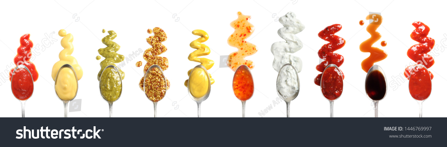 Set of spoons with different delicious sauces on white background, top view #1446769997