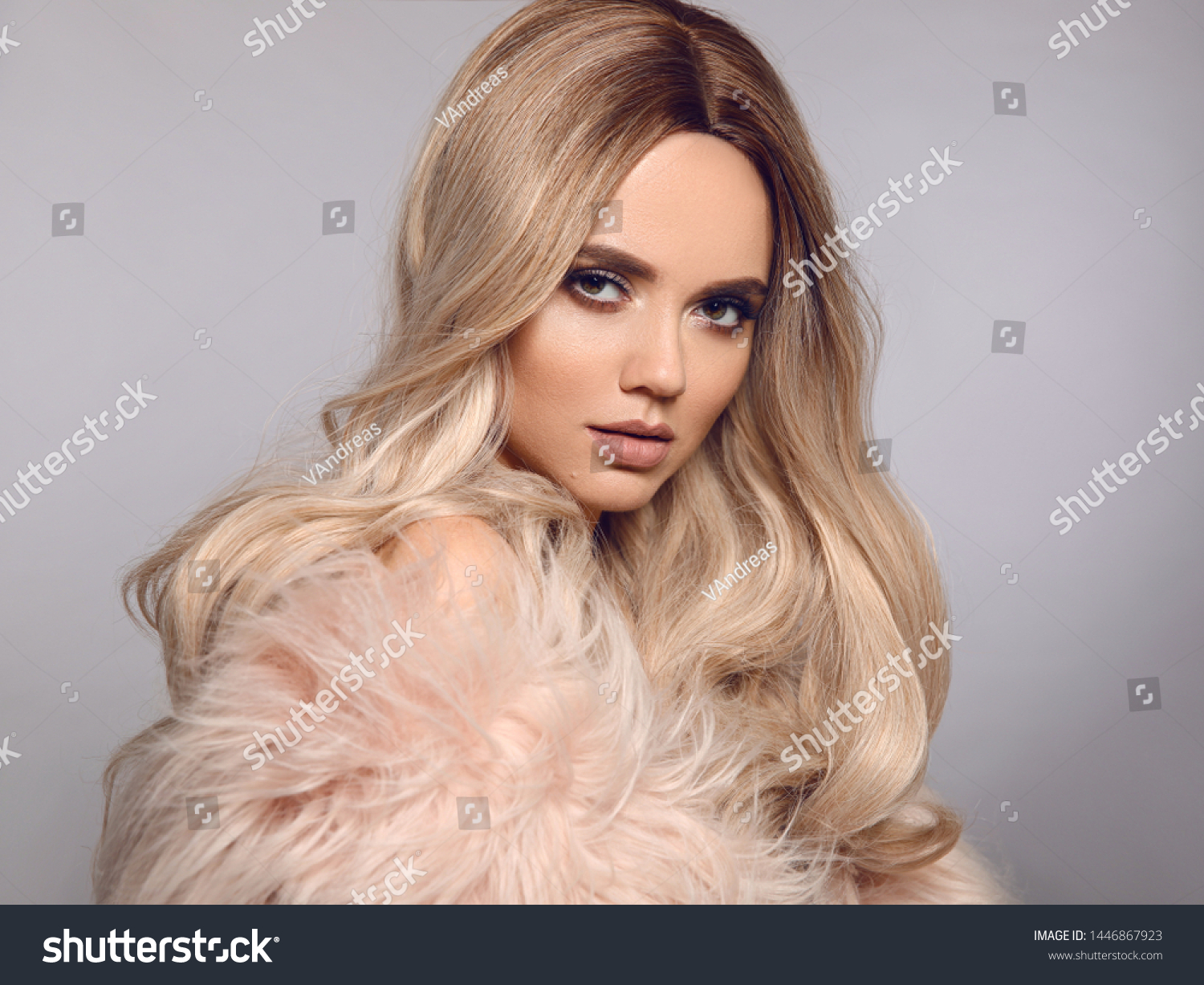 Ombre blond shiny hair. Beauty fashion blonde woman portrait. Beautiful girl model with makeup, long healthy hairstyle posing isolated on studio grey background. #1446867923