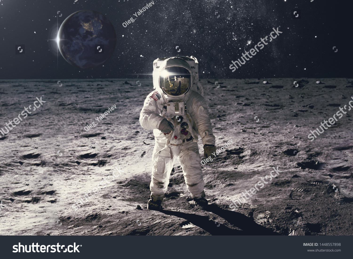 Astronaut on rock surface with space background. Elements of this image furnished by NASA #1448557898