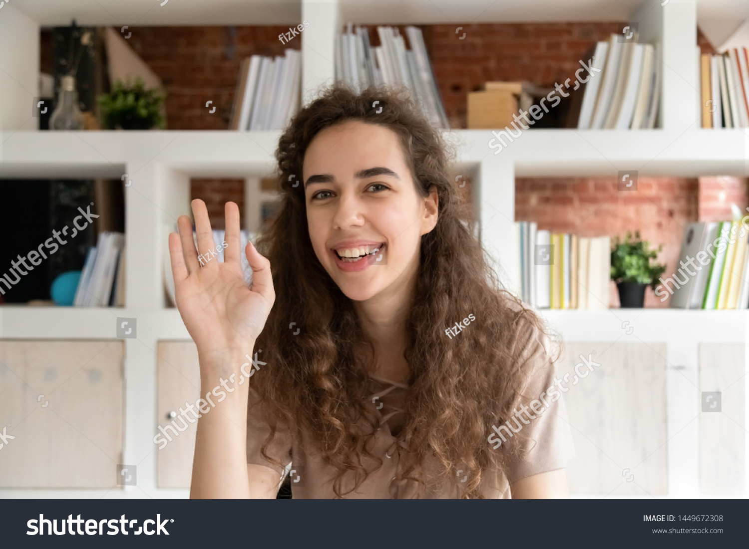 Head shot portrait smiling woman, online teacher waving hand, greeting in distance job interview, looking at camera, using webcam, teenage girl making video call, female vlogger recording vlog #1449672308