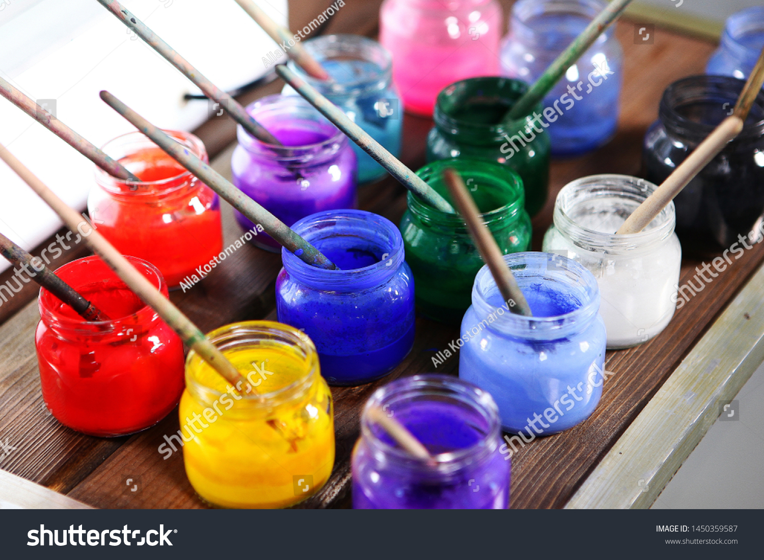 Varied colors of paints for painting in jars close up. The range of colors. Concept hobbies and hobbies. Photo close up. #1450359587