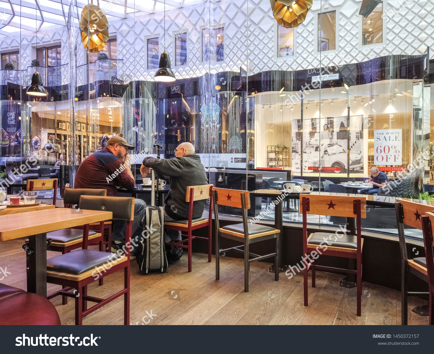 LEEDS, UK - JULY 13, 2019: Customers in the interior of Pret a Manger, a British international sandwich shop chain #1450372157