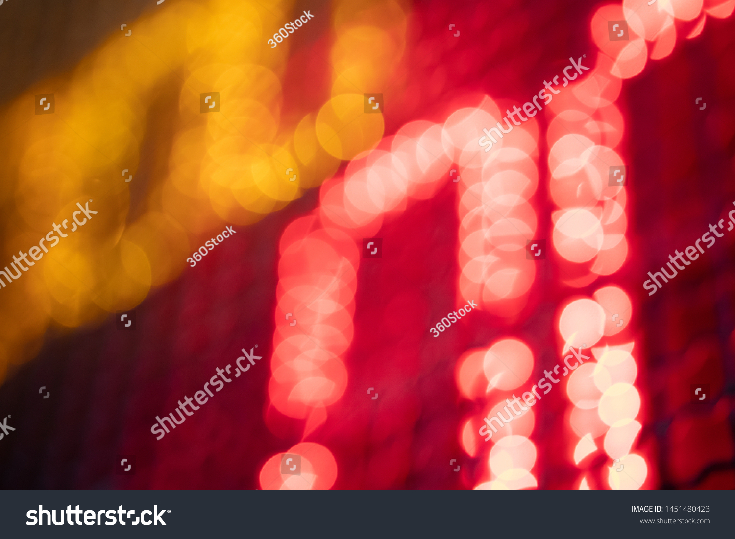 Out-of-focus effect, orange and red LED lights from the scoreboard. Suitable to be a background image. #1451480423