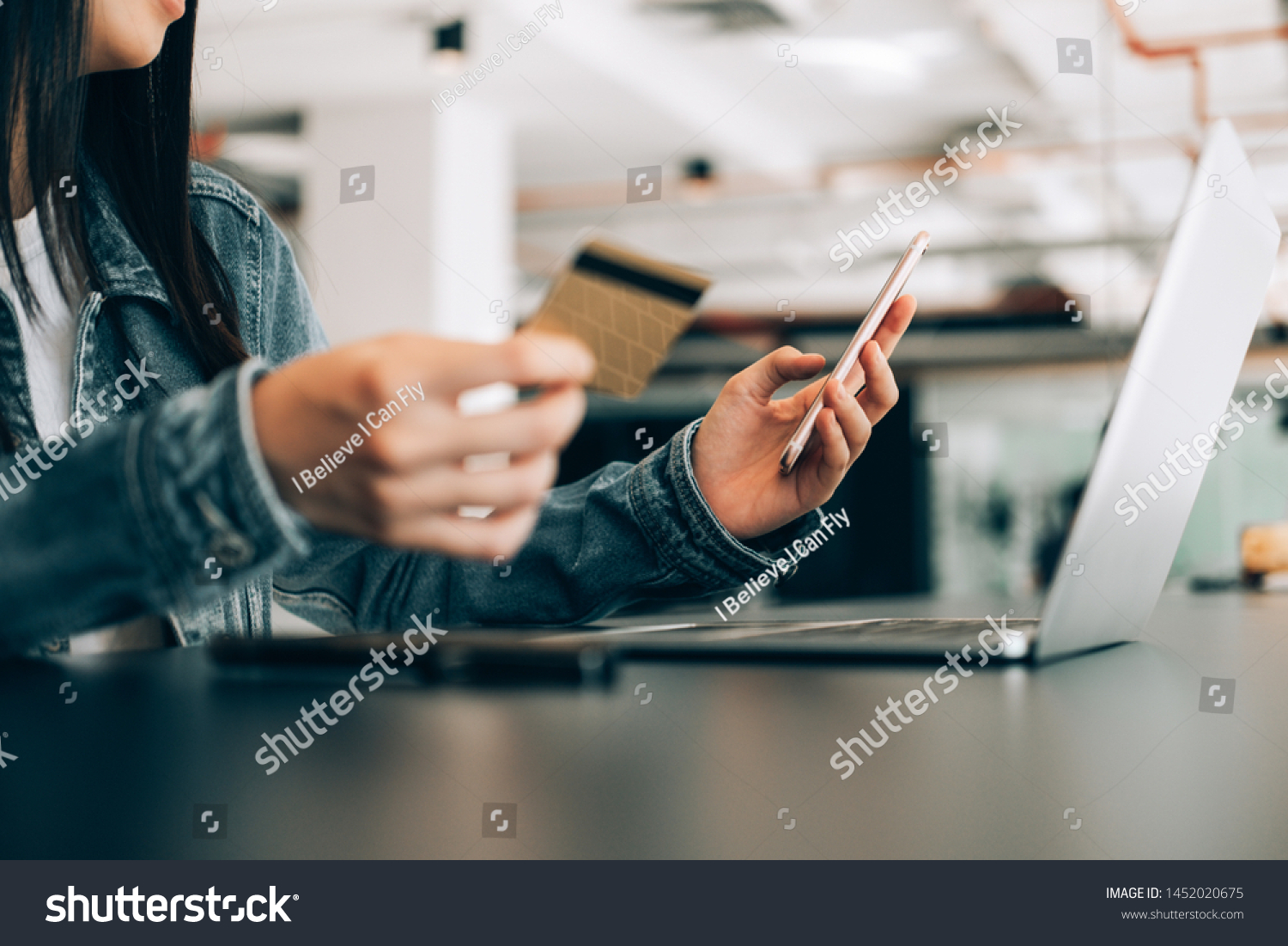 beautiful woman holding credit card and using laptop and smartphone shopping website online, shopping concept
 #1452020675