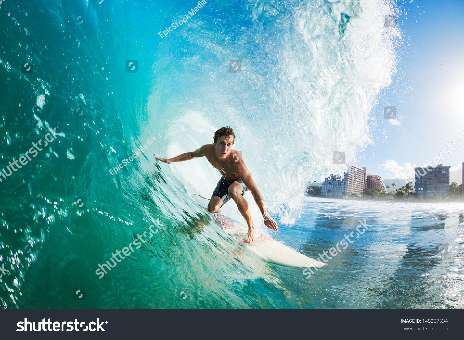 Surfer on Blue Ocean Wave Getting Barreled #145257634
